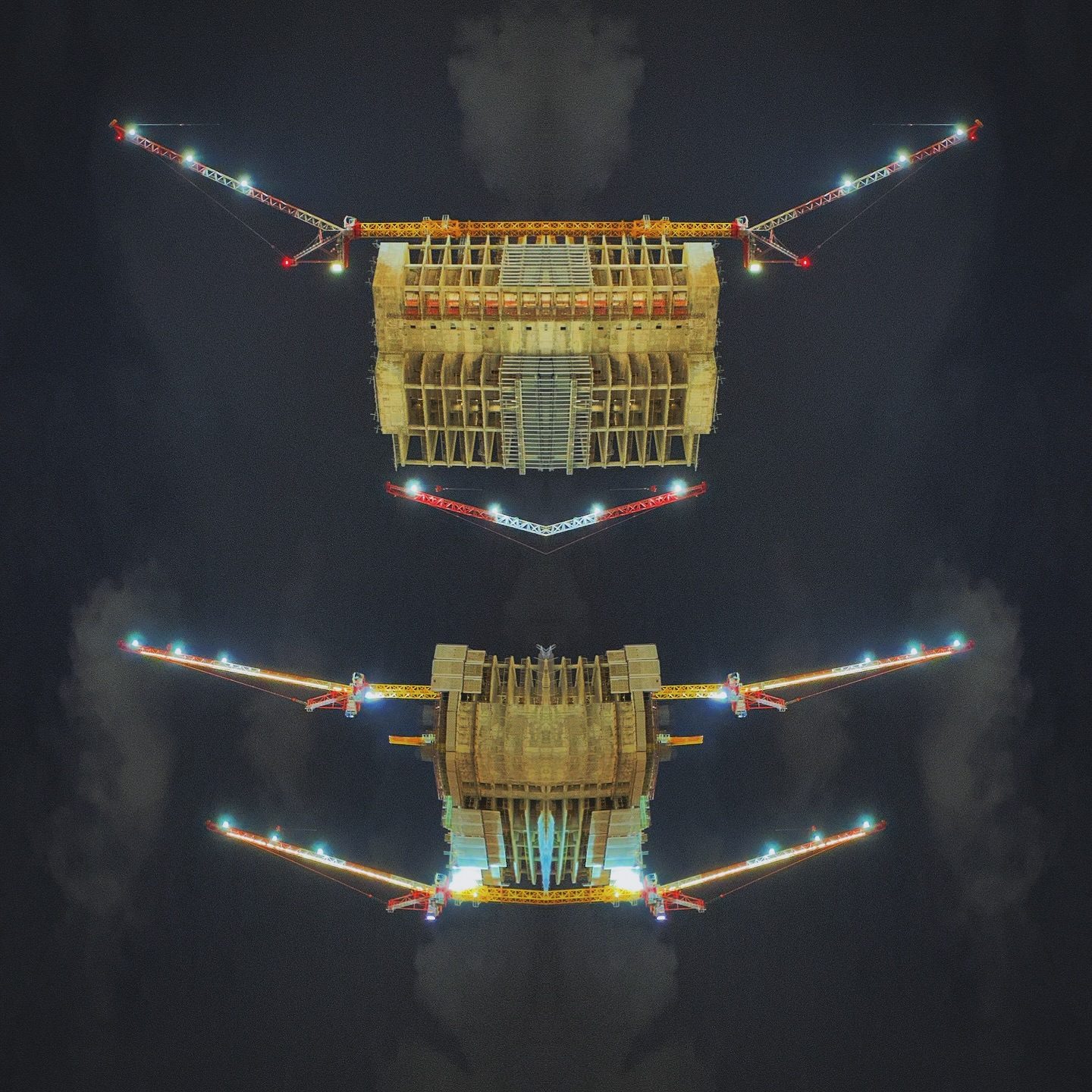Symmetrical illuminated bridge at night